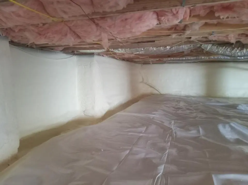 Crawl space encapsulation with closed-cell spray foam for Commercial Roof Restoration in Lumberton
